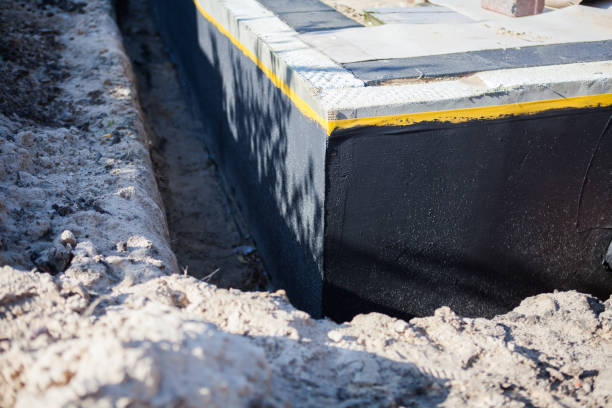 Professional Basement Waterproofing technician working in Winnebago, MN